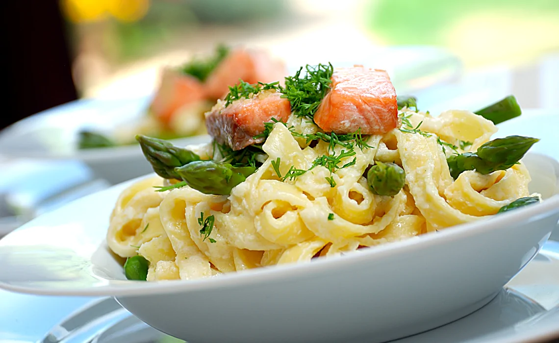 Plate of smoked salmon and asparagus pasta