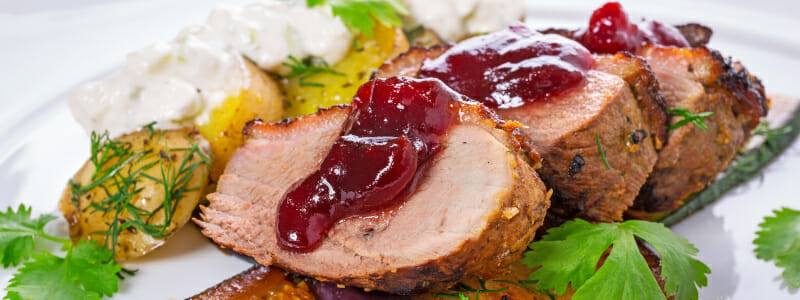 Roasted duck breast with cranberry sauce and vegetables