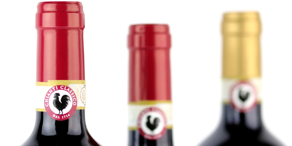 Necks of three bottles of Chainti Classico wine with the Black Rooster insignia