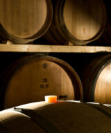 Oak barrels in the wine ageing room Le Morette winery, Lugana DOC, Veneto, Italy