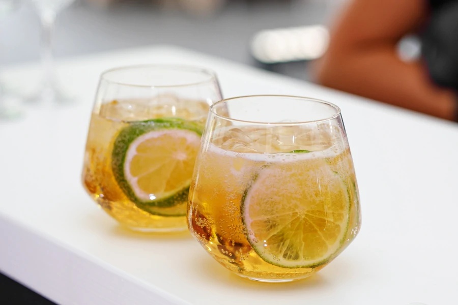 Grappa and tonic cocktail with a slice of lime