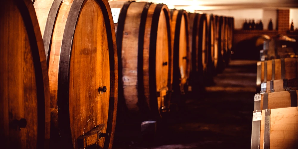 Large Slavonian oak barrels in ageing cellar in Francone winery in Neive, Barbaresco, Piemonte