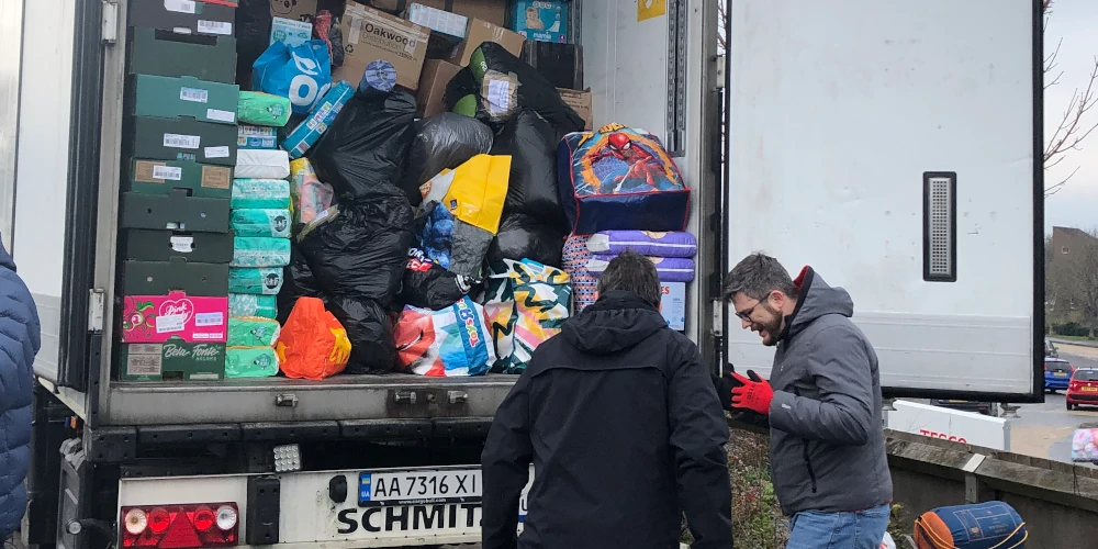 Oleg and Elvira loading lorry with aid for Ukraine. Musselburgh, Edinburgh